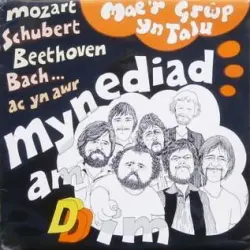 Mae’r Grŵp Yn Talu